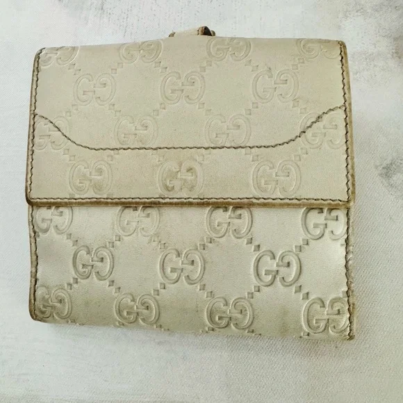 Gucci Guccissima Ivory Leather GG Logo BiFold Wallet, Gold Piston Closure